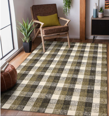 Living room with a checkered rug, brown chair, and plants.