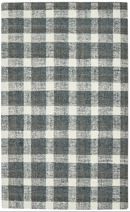 Checkered rug with gray and white pattern on a plain background