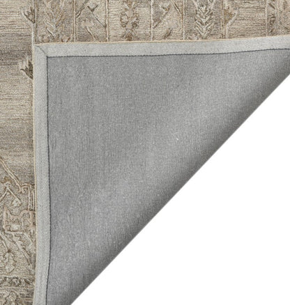 Gray rug with a textured border on a white background