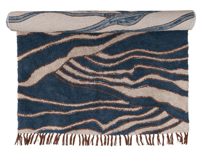 Rug with blue and beige wavy pattern on a white background