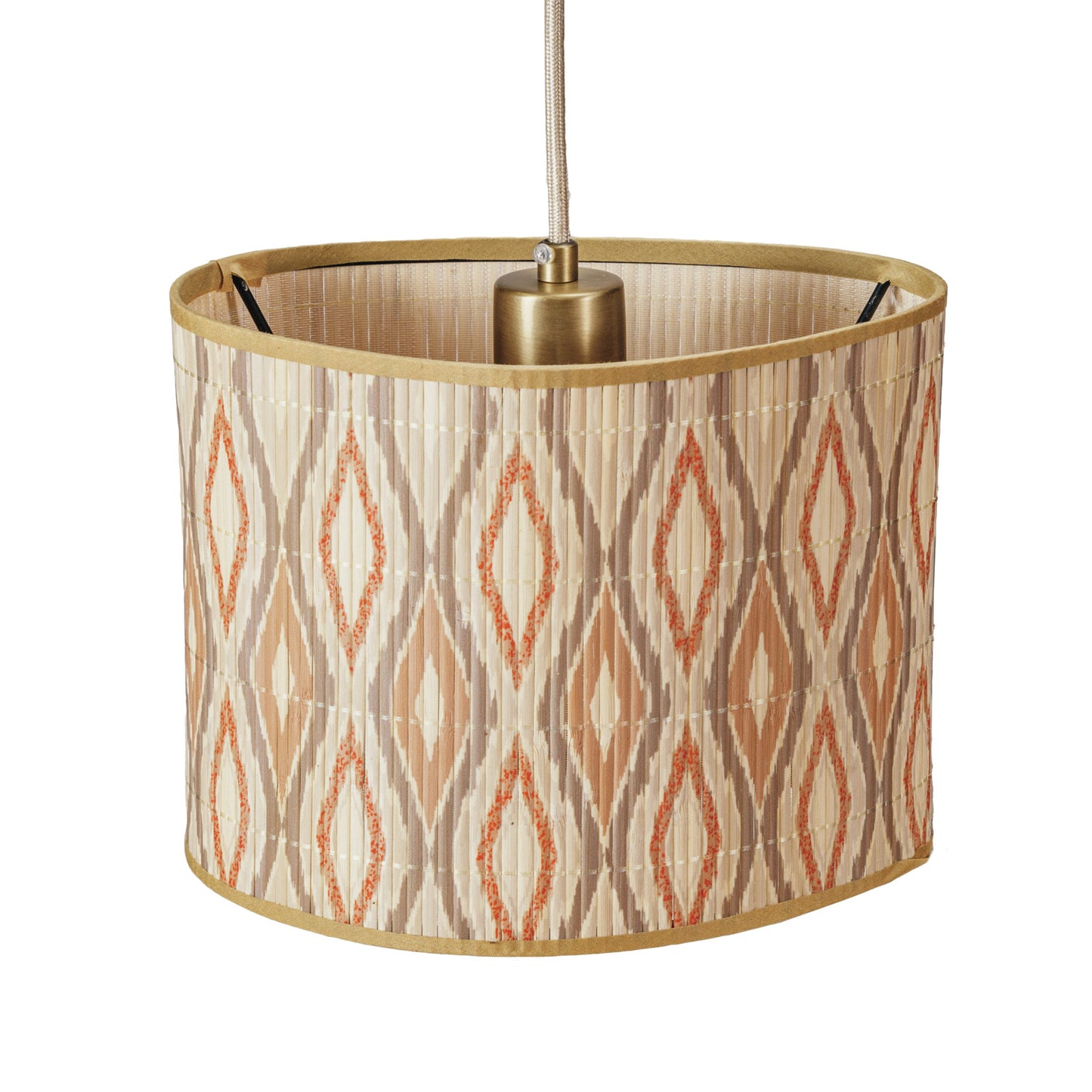 A drum-shaped pendant lamp shade with a beige, brown, and orange geometric ikat pattern, finished with a gold metal rim and a gold-toned central cap, suspended by a gold cord against a white background.