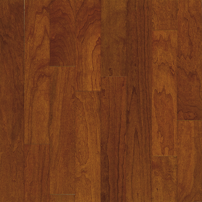 Close-up of a wooden floor with a rich brown color and visible grain pattern.