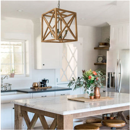 Modern kitchen with wooden pendant light, marble island, and stainless steel appliances.
