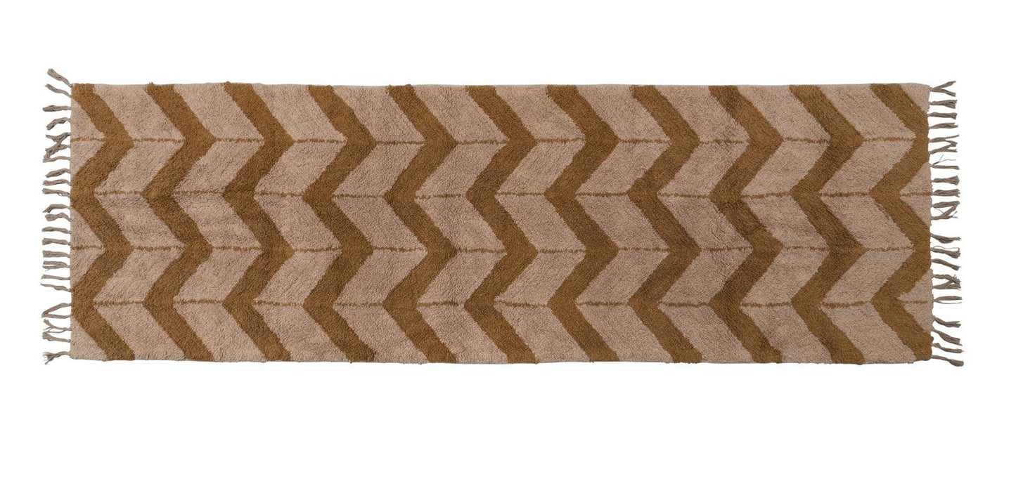 Chevron patterned rug with brown and beige colors on a white background