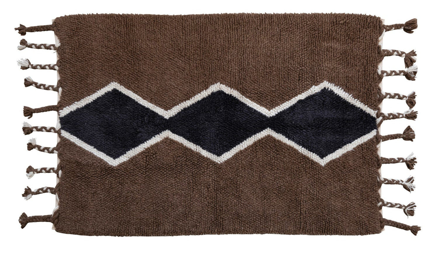Woven rug with zigzag pattern and tassels on a white background