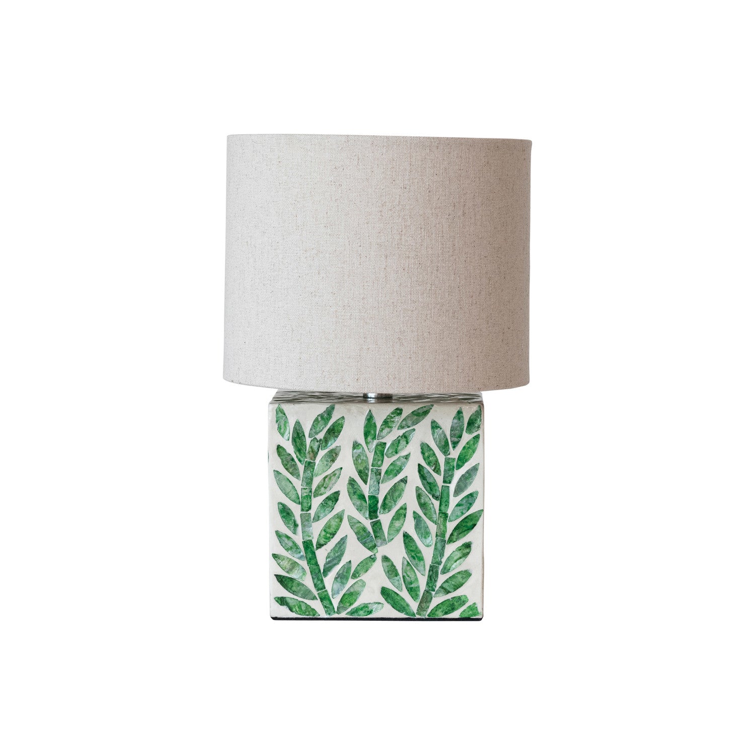 Table lamp with green leaf pattern on a white background