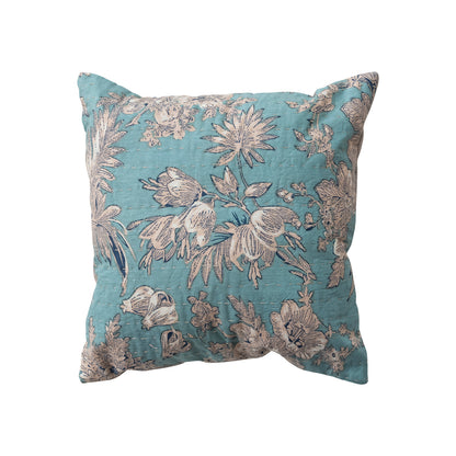 Decorative pillow with floral pattern on a blue background
