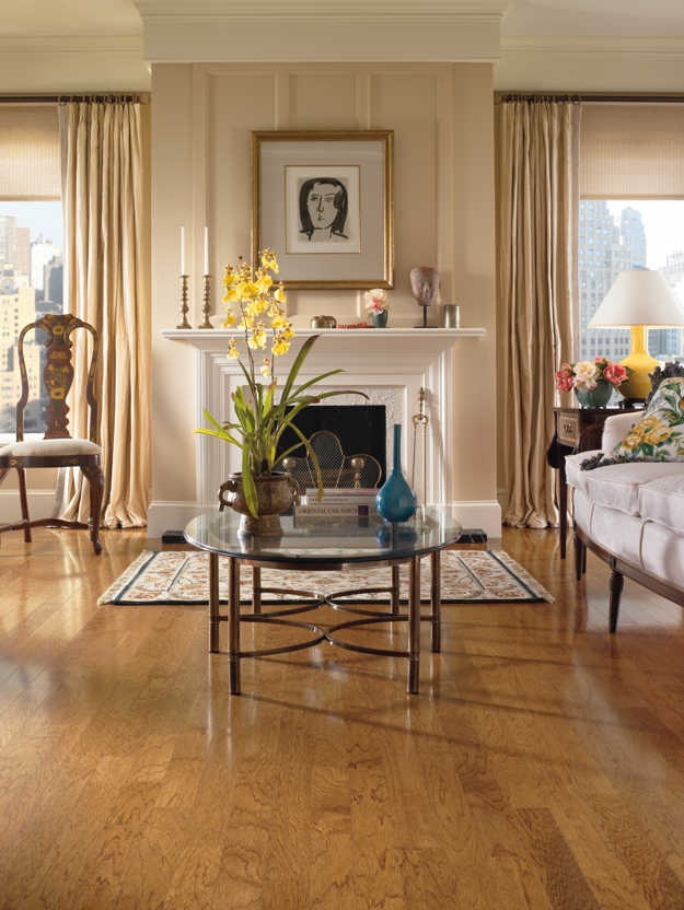 Living room with a fireplace, coffee table, and decorative items.