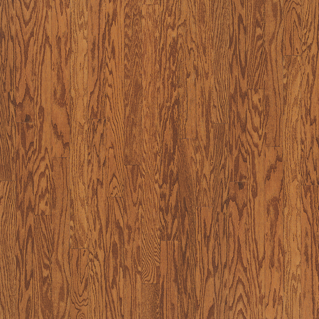 Close-up of a wooden floor with a warm brown color and visible grain pattern.