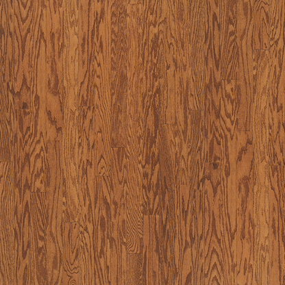 Close-up of a wooden floor with a warm brown color and visible grain pattern.