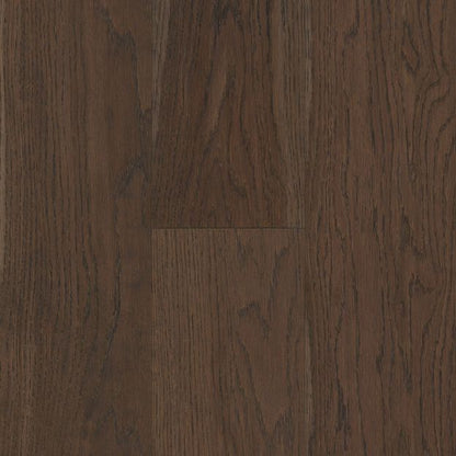 Close-up of dark brown wood flooring with visible grain and texture.