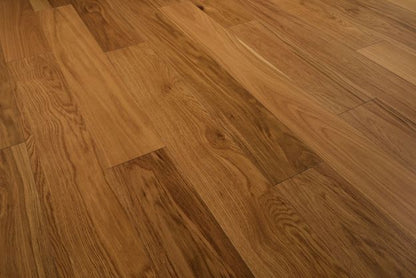 Close-up of a wooden floor with a warm brown color.