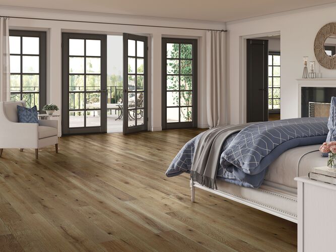 Modern bedroom with wooden flooring, bed, and large windows.