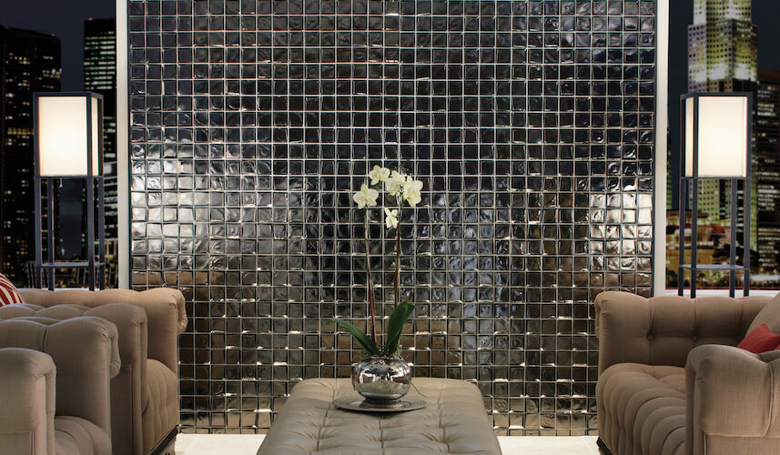 Modern living room with glass mosaic wall and cityscape view
