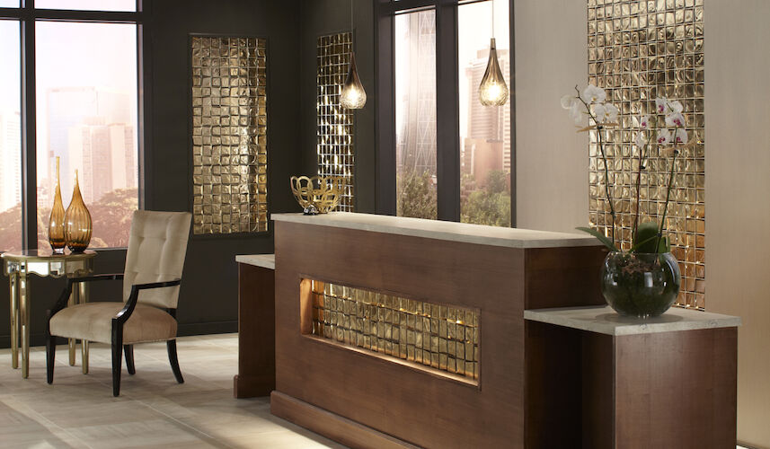 Modern interior design with a reception desk, chair, and decorative elements.